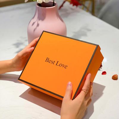 China Medium Size Lid Base Recyclable Wholesale Orange Gift Boxes With Ribbon for sale