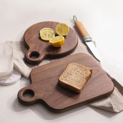 China Black Walnut Sustainable Cutting Board Solid Wood Bread Tray , Wooden Cutting Board With Handle For Kitchen for sale