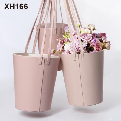 China Handmade Portable Leather Bucket Flower Embrace Round Flower Packaging Box Bouquet Gift Box for sale