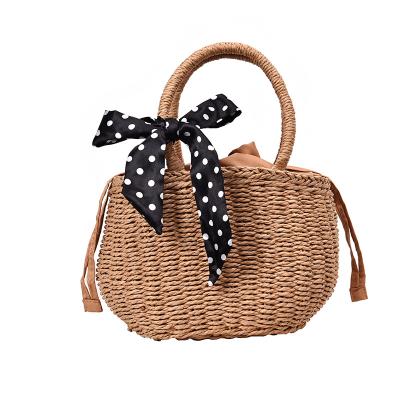 China 2019 New And Fresh Bohemian Small Bucket Bag Summer Beach Rattan Handbag Clutch Bag Grass Woven Straw for sale