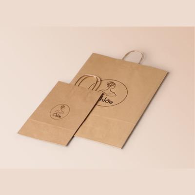 China Recyclable Hot Selling Kraft Paper Shopping Bags With Handles for sale