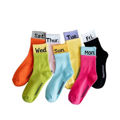 China JR-221 Sustainable Super Hot Candy Color Jacquard Lettering Cotton Socks Printed Week Letter Crew Socks for sale