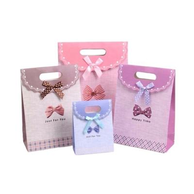 China Logo Printing Luxury Small Pink Recyclable White Fashion Gift Paper Bag Retail Shopping Custom With Ribbon Handle for sale