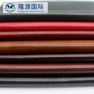 China 0.6mm waterproof PU synthetic leather price good customized for notebook for sale