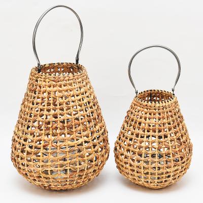 China Home Decoration Stainless Steel Handle Lantern 2 Sizes New Design Oval Decorative Wall Hanging Cavity Rattan Woven Candle Wood Lantern for sale