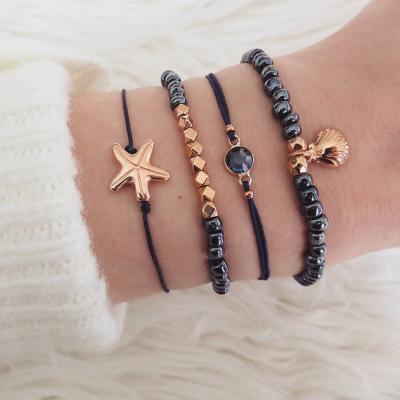 China SinDlan 4pcs/set Cute Women Bracelets Fashion 2021 New Tide Starfish Shell Treasure Blue Bead Chain Black Rope Alloy Bracelet for sale