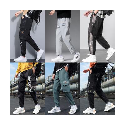 China Latest Custom Designs Anti-Wrinkle Mens White Splice Trekking Track Cargo Work Pants Casual Anorak Pants For Men for sale