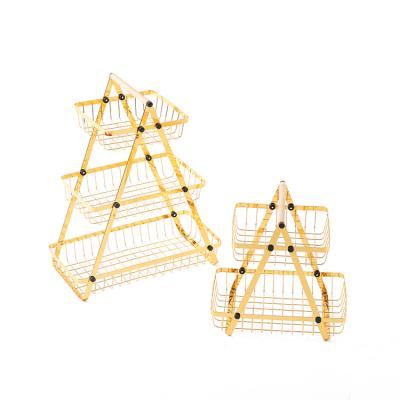 China Stocked 2 Tier Fruit Basket Kitchen Gold Metal Wire Vegetable Storage Baskets With Universal Wheel Balance Feet for sale