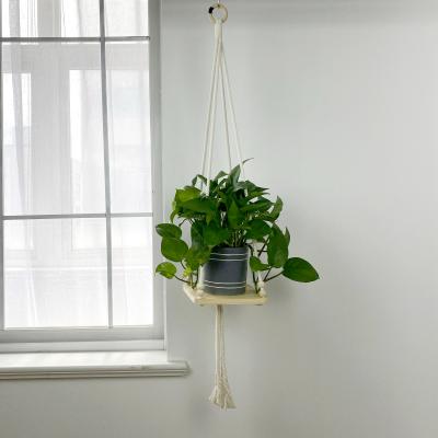 China Simple Macrame Plant Holder Boho Home Decor Beads Wall Hanging Art Plant Hanger With Square Board for sale