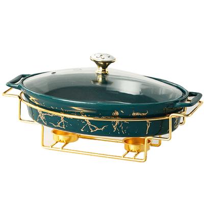 China Sustainable Luxury Gold Oval Ceramic Restaurant Cookware Food Warmer Chafing Dish Buffet Dishes With Glass Lid for sale