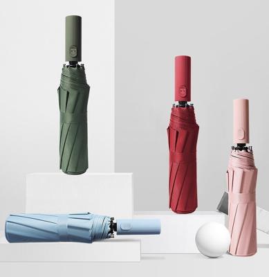 Chine Cadre en acier entièrement automatique étanche au vent triple pliable 10K parapluie pour hommes et femmes à vendre