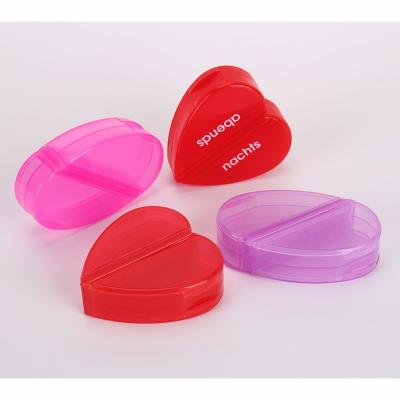 China Hot Selling Heart Shaped Pill Box Portable Oval Pill Box Heart Shaped Pill Package Tablet Container for sale