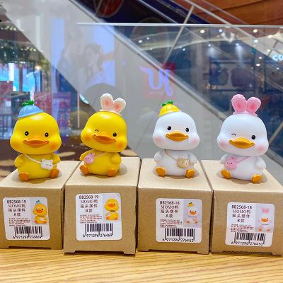 China Home Office Animal Car Small Duck Head Shaking Pattern Interior Accessories Decorative for sale