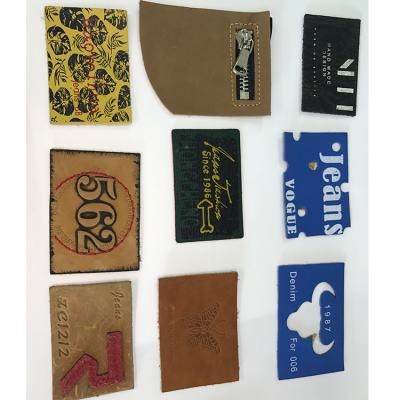 China Sustainable Factory Wholesale Custom Labels PU Embossed Clothing Leather Label Material For Garment for sale