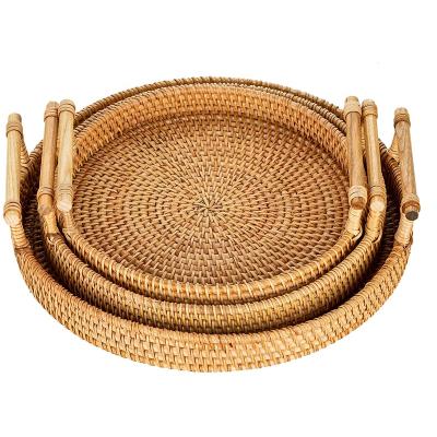 China Handmade - 2021 Large Rustic Decorative Round Rattan Woven Wood Serving Tray with Handles for Breakfast and Drinks for sale