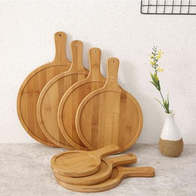 China Sustainable Stylish Round Large Size Various Zero Pollution Fruit Steak Bamboo Pizza Cutting Board Eco-Friendly Tray With Handle for sale