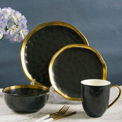 China Sustainable Fashion Nordic Luxury Gold Porcelain Ceramic Tableware Sets 16 Pcs Matte Gold Black Ceramic Tableware for sale