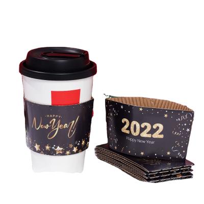 China 2022 Happy New Years Recyclable Coffee Cups Sleeves For 12oz 16oz Hot Drinks And Cold Beverage Christmas Black Thicken Paper Sleeves for sale