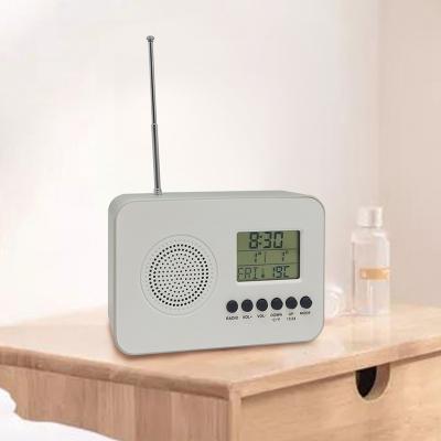 China Hot New Radio Amazon Design LCD Desktop And Table Clock Mini Portable Digital Alarm FM Multifunction Radio Clock for sale