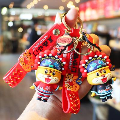 China 2022 winged chinese years by kawaii cute lucky tiger doll key chain waterproof luxury cartoon tiger key chain llaveros for sale