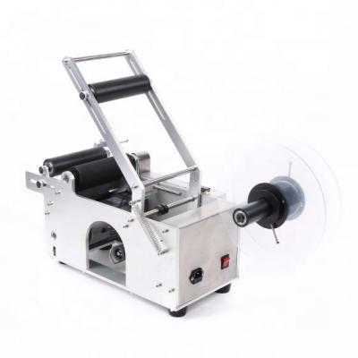 China YTK-50 food hand press round bottle semi automatic labeling machine for adhesive sticker factory price for sale