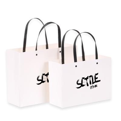 China Eco-Friendly Recycled Materials Packaging Wedding Gift Bag Rivet Portable Thickened Paper Bag for sale