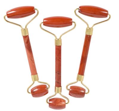 China Face Lift 100% Natural Red Jade Stone Roller Facial Massager Tool With Customized Box for sale