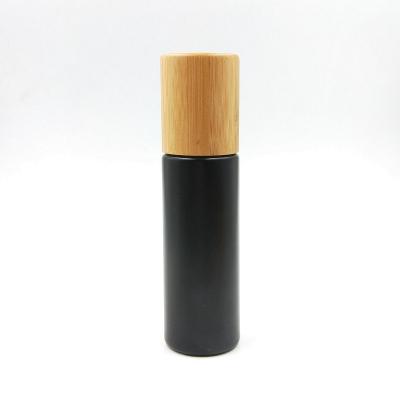 China 100ml Double Wall Frosted Black Bottle With Bamboo Pump Lid For Lotion Use for sale