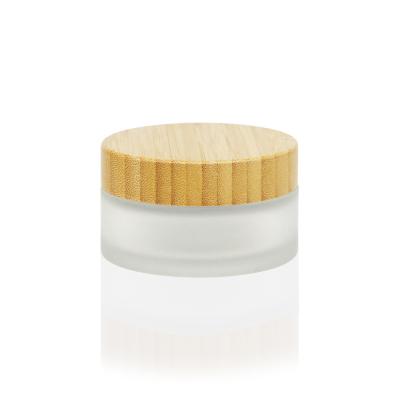 China Hot Selling Cosmetic Container 3.5oz Cosmetic Squat Form Lid Glass Bamboo Container For Face Cream for sale