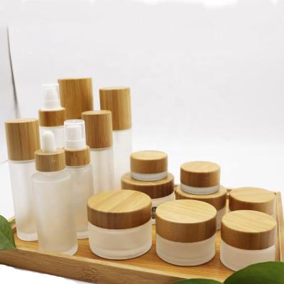 China Household Luxury Cosmetic Packaging 10g 20g 30g 50g 100g 200g Cream White Frosted Glass Jars With Bamboo Lid for sale