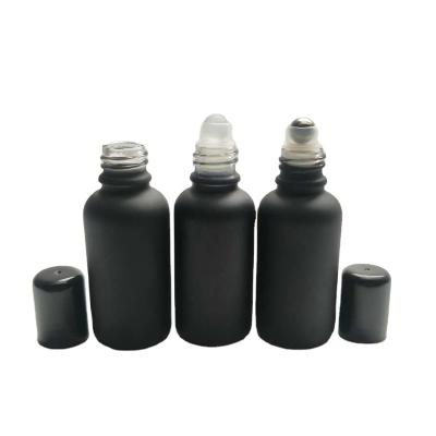 China Personal Care Roll Ball Glass Bottle Black Empty Black Essential Oil Roll-On Sleeve Bottles 30ml Roll On Bottle for sale