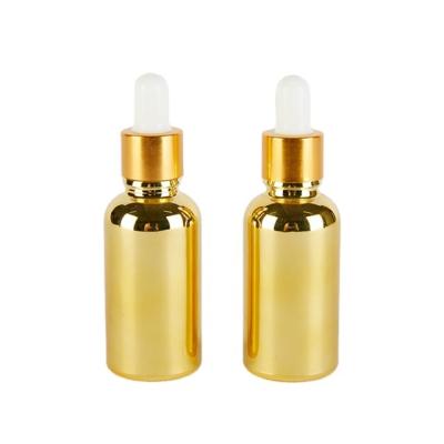 China Personal Care 30ml Gold Plated Glass Bottle With Dropper for sale