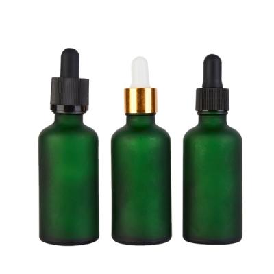 China Personal Care 50ml Frosted Green Glass Bottle With Gold And Silver Dropper Lid for sale