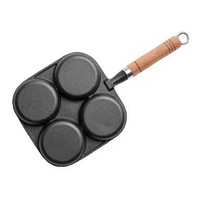 China CLASSIC Cast Iron Frying Pan Deep Fried Egg Pan Egg Burger Mold Household Four Hole Flat Bottom Non-stick Frying Pan with Wooden Handle for sale