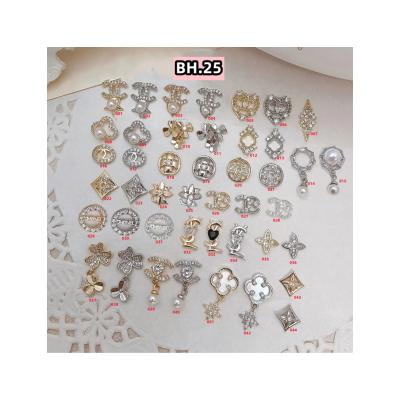 China Metal BH.25 Decoration for Nail Art Logo Design Nail Charms Brand Name Rhinestone for Diy Phone Case Card Issuance for sale