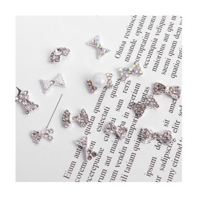 China ALLOY Wholesale of nail accessories, bow shaped nail alloy jewelry, pearl inlaid diamond, bow shaped nail nail diamond for sale