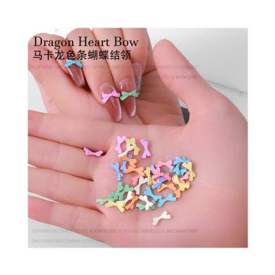 China Alloy 2023 Autumn New Alloy Ribbon Bowknot Nail Enhancement Pure Desire Ornaments Ins Hot Selling Bowtie Spray Nail Ornaments for sale