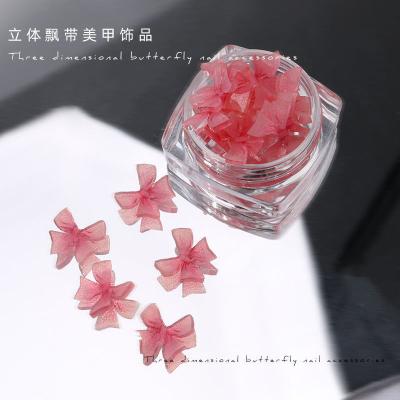 China Resin 2023 Autumn New 3D Ribbon Bowknot Nail Jewelry New Handmade Resin Small Butterfly Nail Diamond for sale