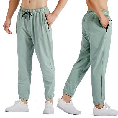 China Fitness Viable Mens Jogger Cargo Pants With Zipper Pocket Loungewear Quick Dry Fitness Pants Springs Basketball Wear for sale