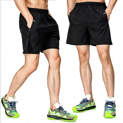 China Breathable sports ice five-cent quick-dry breathable slim pants men's zipper shorts casual fitness running joggers for sale