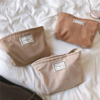 China Women's Custom Large Zipper Travel Soft Waist Solid Color Fashion Corduroy Makeup Bag for sale