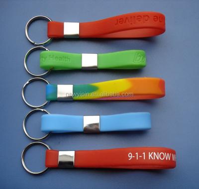 China Sport / Fashion Debossed LOGO Silicone Wristbands Key Chain Key Chain for sale