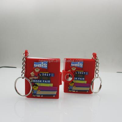 China Custom Mini Book 3D Non-Toxic Rubber Keychain Notebook Form Soft PVC Key Chain for sale