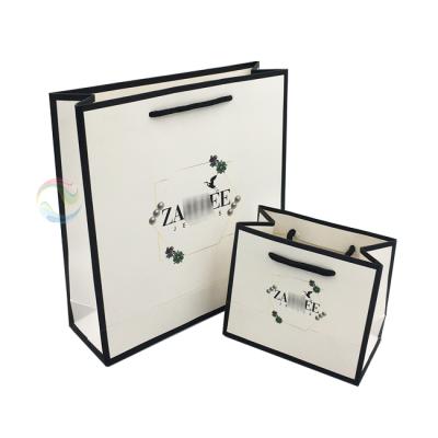 China Recyclable Luxury 250 Gsm Printed Logo Paper Bag Packaging For Garments for sale