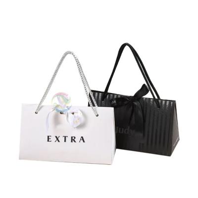 China Recyclable Baby Fashion Small Black Gift Paper Packaging Bag China Manufactures for sale