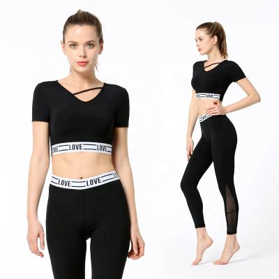 China Breathable Fashionable Yoga Suit Tight-Fitting High Waist Yoga Pants Maiden Letter Stitching Short Sleeve Sports Invest Two-p for sale