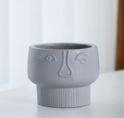 China Art Decor Wholesale Custom Design shaped plant pot supplier cement black face shape planters flower pots for sale