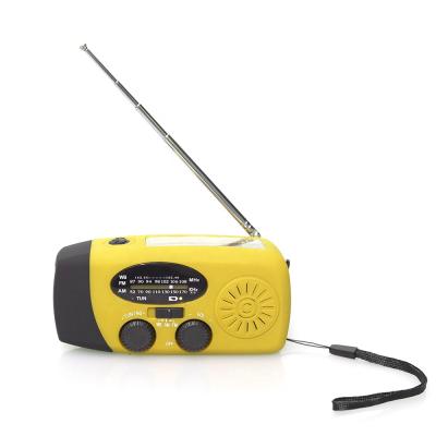 China Eco-friendly yellow color rechargeable mini am radio fm led flashlight emergency hand crank solar radio for sale