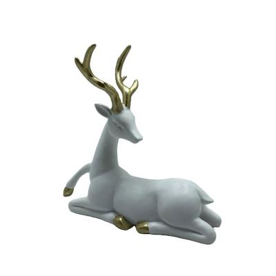 China Polyresin White Sitting Reindeer For Christmas Decoration for sale