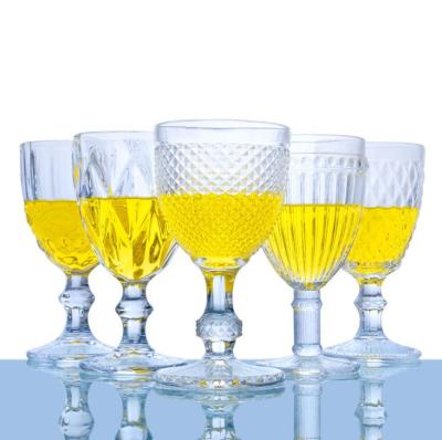 China Cheap transparent thick wine cup vintage glass champagne flutes embossed wine glass goblet for sale